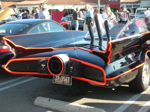 1998 Ford Crown Victoria - Rear view of a black Batmobile replica with orange-red trim, a chrome jet-style exhaust nozzle and a 2F-3567 Gotham plate.