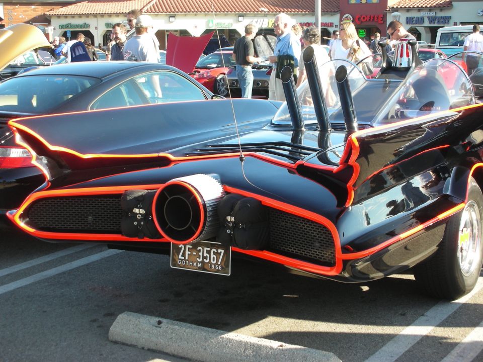Rear of black Batmobile replica with red trim, jet-style nozzle and Gotham plate