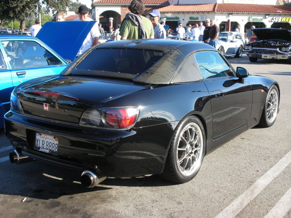 Rear three-quarter of black Honda S2000 hardtop with plate XLR8888