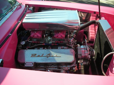 1998 Ford Crown Victoria - Customized engine bay chrome components and dual carburetors, with 'Bel Air' valve covers visible.