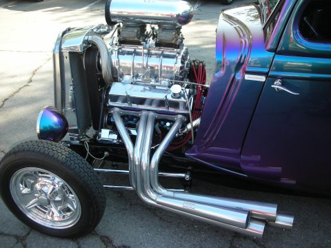 1998 Ford Crown Victoria - Custom hot rod features a prominent supercharger and V8 engine with shiny exhaust headers.