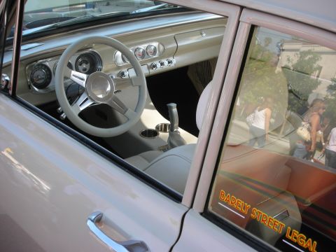 1998 Ford Crown Victoria - Interior view of a classic car, a custom steering wheel and a 'Barely Street Legal' sticker on the window.