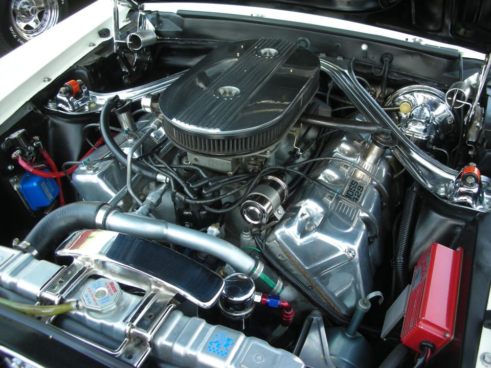 Chromed V8 engine bay with oval air cleaner and braided lines