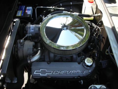 1998 Ford Crown Victoria - Close-up of a Chevrolet engine bay, showing the air intake and valve covers.