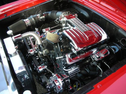 1998 Ford Crown Victoria - Close-up of a polished Ford Cobra engine bay with custom parts.
