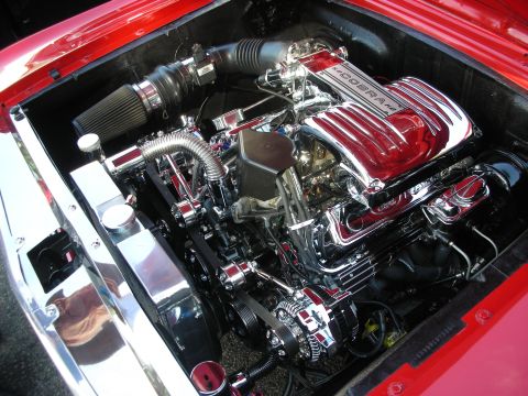 1998 Ford Crown Victoria - A highly polished engine bay features a chrome Cobra V8 engine with a custom air intake system.