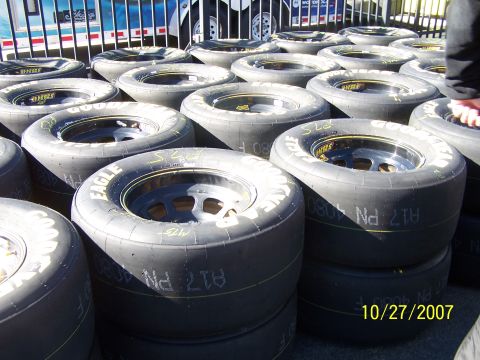 1979 Ford F-150 - Multiple Goodyear Eagle racing tires are stacked up, with a date stamp visible on one of the tires.