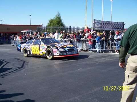 1979 Ford F-150 - A race car with Snickers branding and the number 88 is on display for spectators.