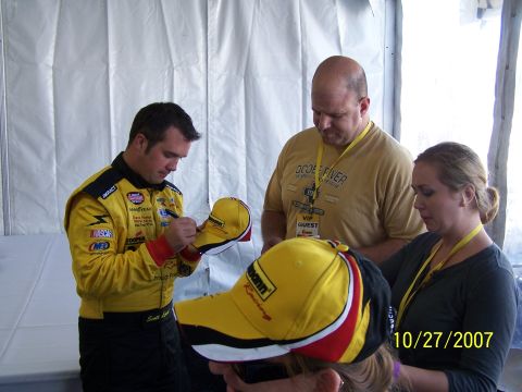 1979 Ford F-150 - A driver signs autographs for fans at an event. The date 10/27/2007 is visible in the lower right corner.