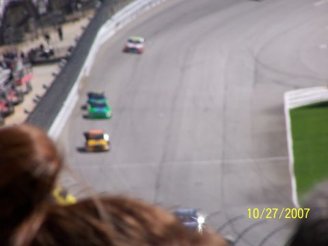 1979 Ford F-150 - Several race cars are visible on a track, with spectators in the foreground and a date stamp of 10/27/2007.