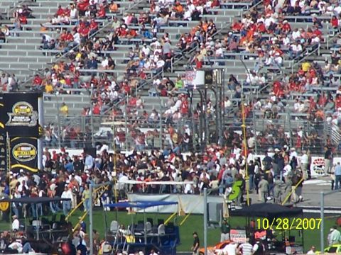 1979 Ford F-150 - A large crowd fills the stands and track area at a race event, dated October 28, 2007.
