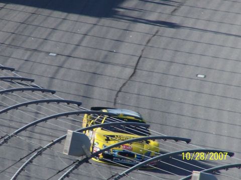 1979 Ford F-150 - A yellow race car speeds around a track, with a date stamp of 10/28/2007 visible.