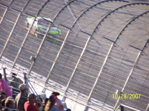 1979 Ford F-150 - A race car speeds around a track, viewed from the stands. The date 10/28/2007 is visible in the lower right corner.