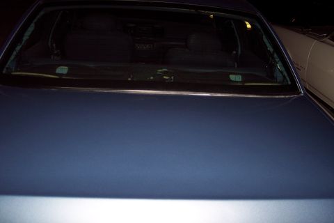 2001 Ford Crown Victoria - Rear view of a blue 2001 Ford Crown Victoria, showing the trunk and rear window.