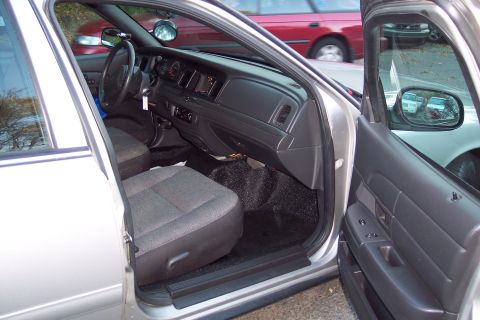 2001 Ford Crown Victoria - Interior view of a 2001 Ford Crown Victoria, highlighting the driver's seat and dashboard.