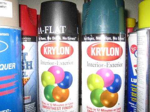 1999 Ford F-250 - A collection of spray paint cans, including Krylon Interior-Exterior, are stored together.
