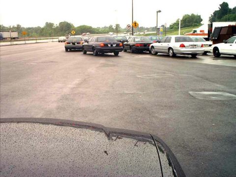 2000 Ford Crown Victoria - Several Ford Crown Victorias are parked in a lot, with one in the foreground showing a 3q-front view.