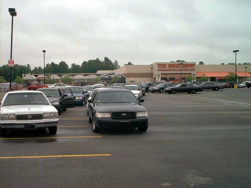 Black 2000 Ford Crown Victoria parked in a lot