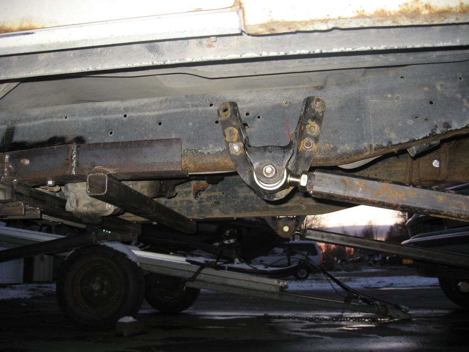 Undercarriage view of custom suspension on a truck frame