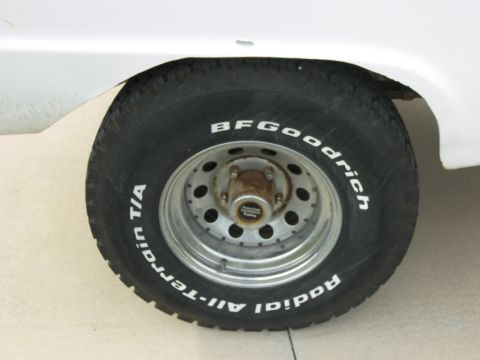 1974 Ford Bronco - Close-up of a tire and wheel assembly with prominent branding visible.