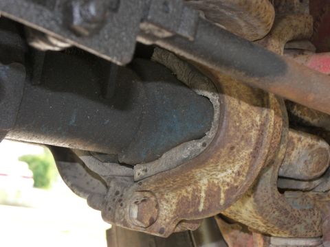 1974 Ford Bronco - Close-up view of rusty suspension components, with a watermark for Supermotors.net visible.