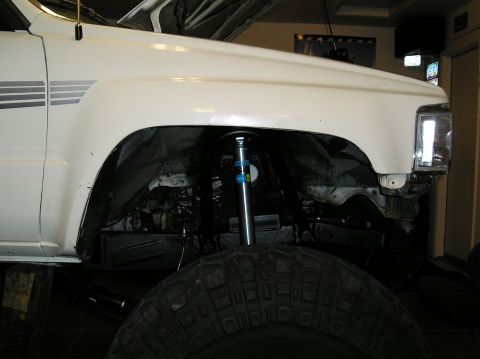 1986 Toyota Hilux - Front wheel well of a 1986 Toyota Hilux, a Bilstein shock absorber and a large tire.