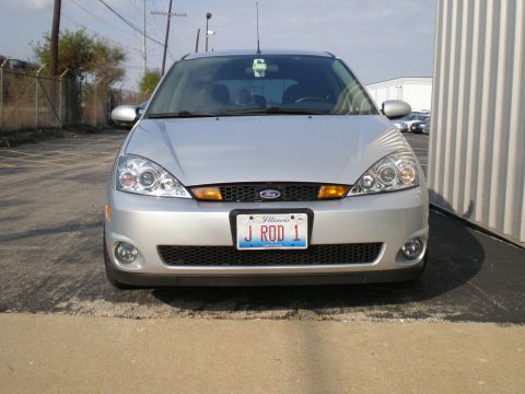 2003 Ford Focus - Front view of a silver 2003 Ford Focus, its grille, headlights, and Illinois license plate.