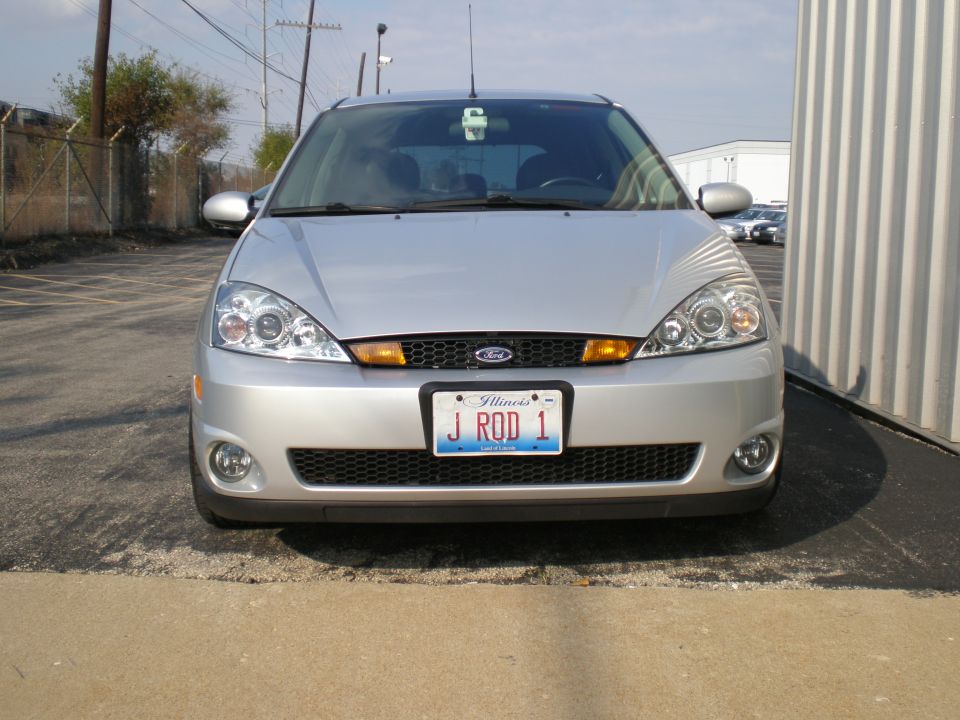 Silver 2003 Ford Focus front view with Illinois license plate J ROD 1