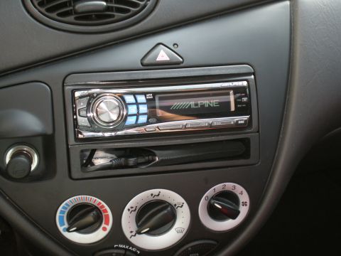 2003 Ford Focus - Dashboard interior of a 2003 Ford Focus, an aftermarket Alpine stereo and manual climate controls.