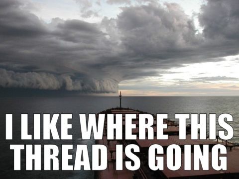 1986 Ford Bronco - A large cargo ship navigates the sea beneath an imposing shelf cloud, with text superimposed on the image.