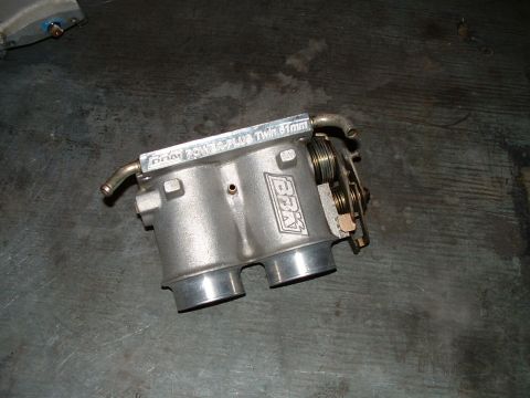 1995 Ford Bronco - A BBK 70mm twin throttle body with 61mm bores is shown.