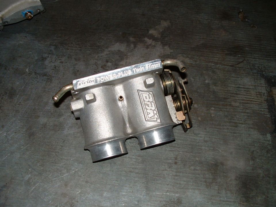 Dual throttle body with "BBK 70mm Twin 61mm" text