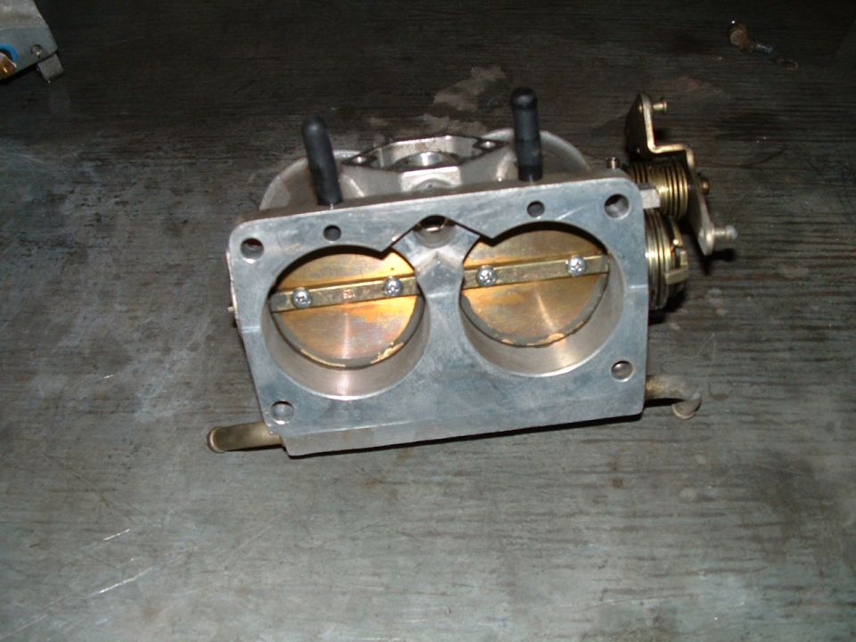 dual throttle body with two butterfly valves and linkage