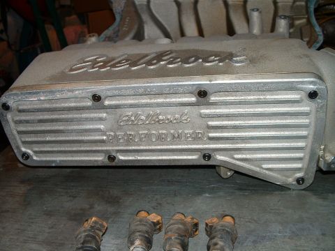 1995 Ford Bronco - Close-up of an Edelbrock Performer intake manifold with fuel injectors visible below.