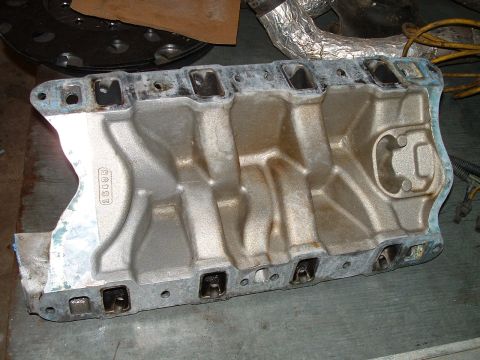 1995 Ford Bronco - An aluminum intake manifold, likely a replacement part, is shown from a top-down perspective.