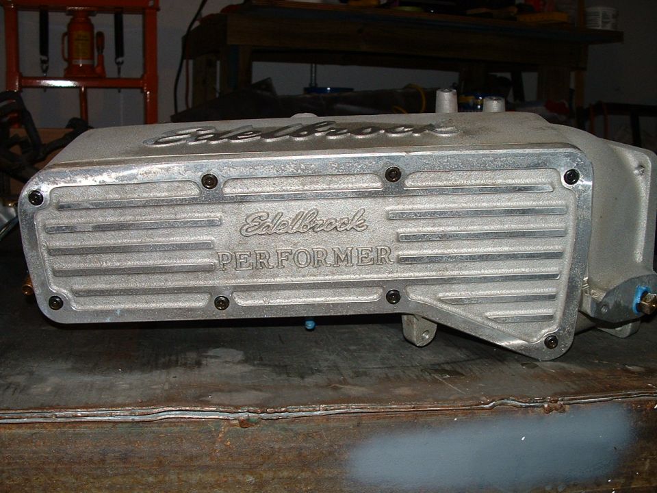 Edelbrock Performer intake manifold on a workbench