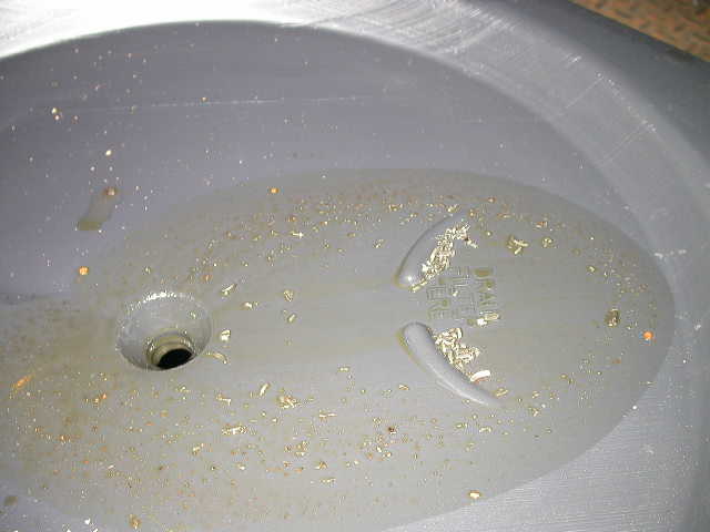 This is bad....metal chips drained out with gear oil.