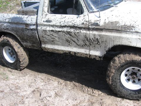 1979 Ford F-150 - This 1979 Ford F-150 is covered in mud after driving through a muddy area.