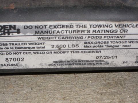 1995 Ford Bronco - Rating label for a trailer hitch shows maximum towing capacity and manufacturing date.