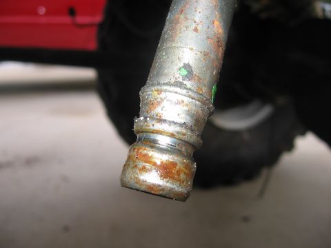 1979 Ford F-150 - This photo shows a rusted metal pipe fitting, not a 1979 Ford F-150 transmission part.