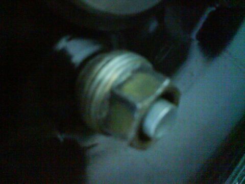 2003 Ford Crown Victoria - A close-up shot focuses on a threaded metal component, likely part of a larger assembly.