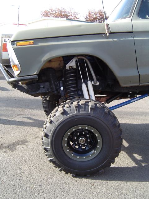 1978 Ford Bronco - This 1978 Ford Bronco features a significant lift kit with dual shocks and large off-road tires.