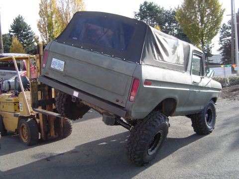 1978 Ford Bronco - A lifted 1978 Ford Bronco is being repositioned by a forklift.