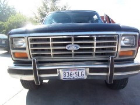 1986 Ford Bronco - Front view of a 1986 Ford Bronco, its distinctive grille and chrome bumper.