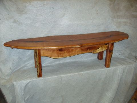 1996 Ford Bronco - A rustic wooden bench with a natural wood grain finish is displayed against a neutral backdrop.