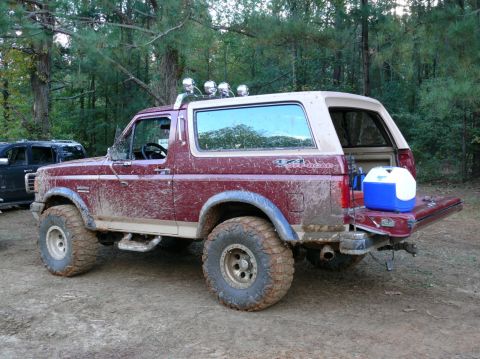1988 Ford Bronco - This 1988 Ford Bronco is covered in mud after an off-road excursion, with a cooler loaded in the open tailgate.