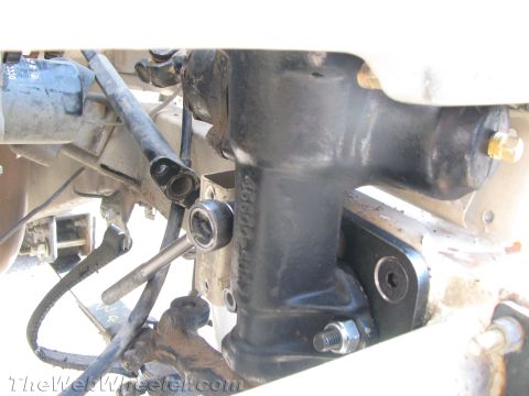 1987 Suzuki Samurai - Power steering gearbox and linkage assembly, likely from a vehicle.