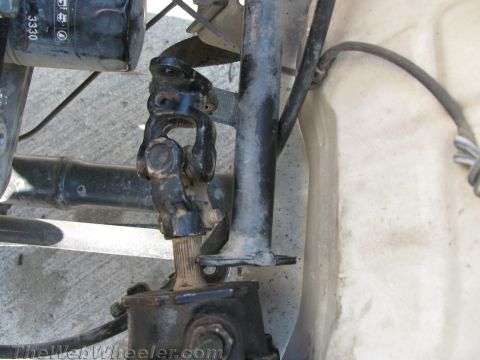 1987 Suzuki Samurai - Close-up of a steering shaft universal joint, showing mechanical components and wear.