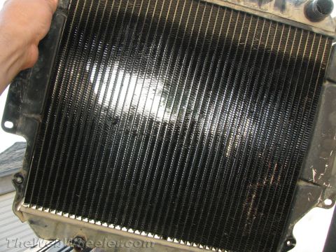 1987 Suzuki Samurai - A radiator part is shown, held by a hand. The registry claims it is from a 1987 Suzuki Samurai.