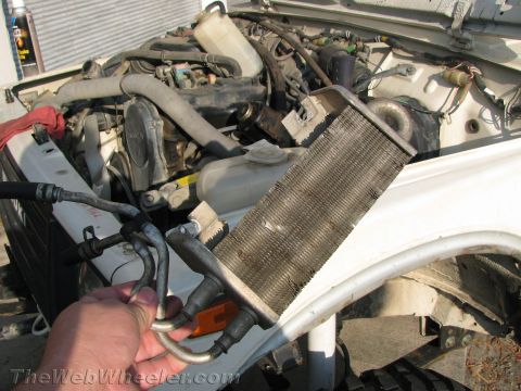 1987 Suzuki Samurai - The oil cooler has been removed from the engine bay of a 1987 Suzuki Samurai.